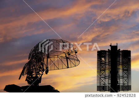 Air defense radars of military mobile anti aircraft systems (radar is designed  and automatic tracking of targets and missiles) , on the background of the sunset orange sky, Russia 92452828
