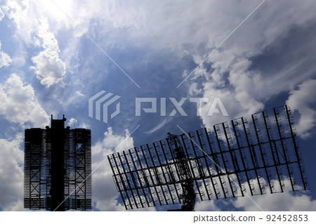 Air defense radars of military mobile anti aircraft systems (radar is designed  and automatic tracking of targets and missiles) , modern army industry on background clouds and sky,Russia 92452853