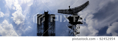 Air defense radars of military mobile anti aircraft systems (radar is designed  and automatic tracking of targets and missiles) , modern army industry on background clouds and sky,Russia 92452954