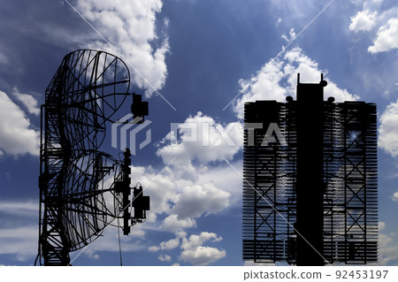 Air defense radars of military mobile anti aircraft systems (radar is designed  and automatic tracking of targets and missiles) , modern army industry on background clouds and sky,Russia 92453197