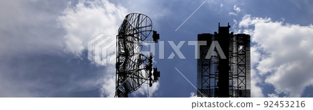 Air defense radars of military mobile anti aircraft systems (radar is designed  and automatic tracking of targets and missiles) , modern army industry on background clouds and sky,Russia 92453216