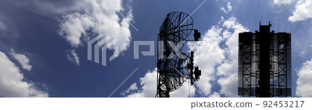 Air defense radars of military mobile anti aircraft systems (radar is designed and automatic tracking of targets and missiles) , modern army industry on background clouds and sky,Russia Air defense radars of military mobile anti aircraft systems (radar is designed and automatic tracking of targets and missiles) , modern army industry on background clouds and sky,Russia 92453217