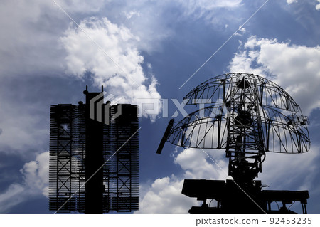 Air defense radars of military mobile anti aircraft systems (radar is designed  and automatic tracking of targets and missiles) , modern army industry on background clouds and sky,Russia 92453235