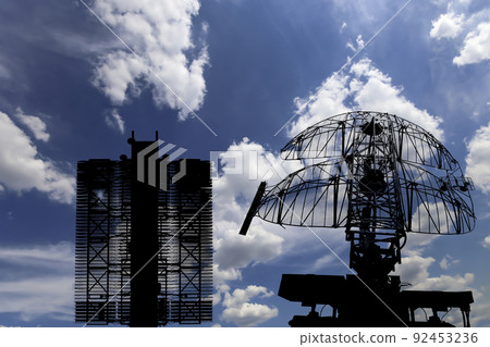 Air defense radars of military mobile anti aircraft systems (radar is designed  and automatic tracking of targets and missiles) , modern army industry on background clouds and sky,Russia 92453236