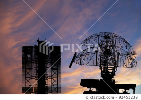 Air defense radars of military mobile anti aircraft systems (radar is designed and automatic tracking of targets and missiles) , on the background of the sunset orange sky, Russia Air defense radars of military mobile anti aircraft systems (radar is designed and automatic tracking of targets and missiles) , on the background of the sunset orange sky, Russia 92453239