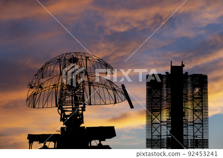 Air defense radars of military mobile anti aircraft systems (radar is designed and automatic tracking of targets and missiles) , on the background of the sunset orange sky, Russia Air defense radars of military mobile anti aircraft systems (radar is designed and automatic tracking of targets and missiles) , on the background of the sunset orange sky, Russia 92453241