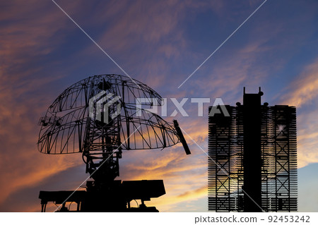 Air defense radars of military mobile anti aircraft systems (radar is designed and automatic tracking of targets and missiles) , on the background of the sunset orange sky, Russia Air defense radars of military mobile anti aircraft systems (radar is designed and automatic tracking of targets and missiles) , on the background of the sunset orange sky, Russia 92453242