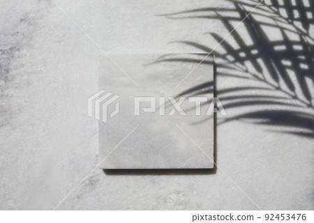 Marble stone display flat lay podium on travertine stone background and palm shadow. Product promotion Beauty cosmetic showcase. 92453476