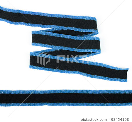 knit stripes elastic ribbon band, webbing, herringbone tapes, lustrous yarn for clothes, trousers, jackets. Stripe and zigzag. elastic sewing material on a white background 92454108
