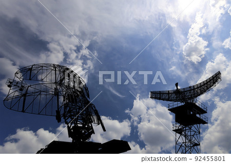 Air defense radars of military mobile anti aircraft systems, modern army industry on background beautiful clouds and sky, Russia 92455801