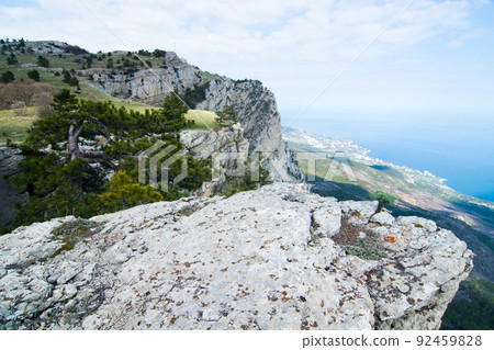 A wonderful and unusually beautiful landscape overlooking the high plateau of the Crimean mountains. Clean and reasonable nature of Crimea. Ukraine, territory occupied by the Russian Federation. A wonderful and unusually beautiful landscape overlooking the high plateau of the Crimean mountains. Clean and reasonable nature of Crimea. Ukraine, territory occupied by the Russian Federation. 92459828