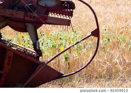 Modern tractor in the field with complex for the plowing. The concept of work in a fields and agriculture industry. Modern tractor in the field with complex for the plowing. The concept of work in a fields and agriculture industry. 92459913