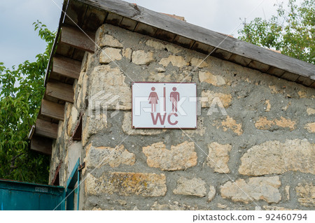 Sign toilet door old stone heart outdoor wood wooden vintage, concept retro tree in sun and sanitation facility, window historic. Europe countryside ancient, 92460794