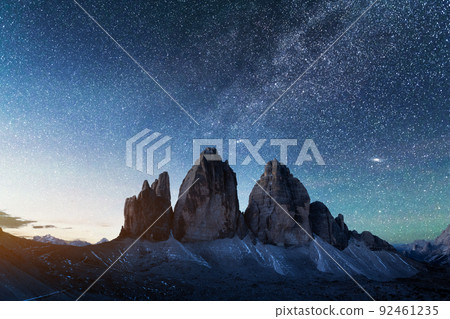 Green tent lighted from the inside against the backdrop of incredible starry sky 92461235