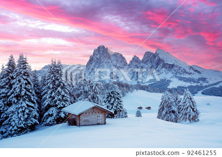 Picturesque landscape with small wooden house on meadow Alpe di Siusi Picturesque landscape with small wooden house on meadow Alpe di Siusi 92461255