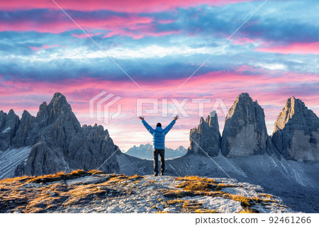Tourist in blue jacket at Three Peaks of Lavaredo track on autumn season 92461266