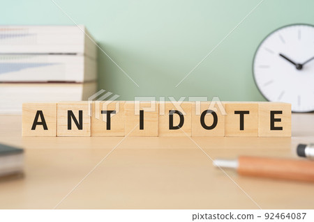 Image of antidote | Desk with a block labeled "ANTIDOTE" Image of antidote | Desk with a block labeled "ANTIDOTE" 92464087