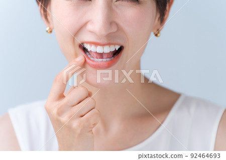 Woman checking teeth 92464693