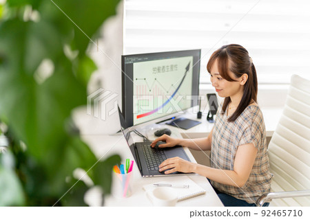 Young female engineer working from home Productivity improvement Efficiency graph Young female engineer working from home Productivity improvement Efficiency graph 92465710