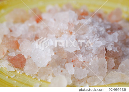 close up of pink rock salt in a bowl on table close up of pink rock salt in a bowl on table 92466686
