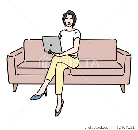 Woman sitting on the sofa and working on a laptop Woman sitting on the sofa and working on a laptop 92467131