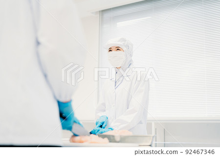 Men and women of workers working in food processing (meat and food factories) Men and women of workers working in food processing (meat and food factories) 92467346