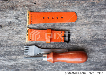 Orange leather smart watch strap hand made on wood Orange leather smart watch strap hand made on wood 92467944