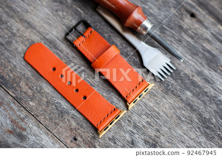 Orange leather smart watch strap hand made on wood Orange leather smart watch strap hand made on wood 92467945