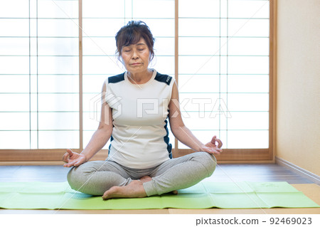 Senior woman doing yoga 92469023
