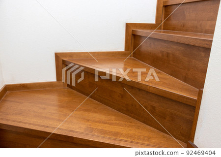 The bend of the wooden stairs 92469404