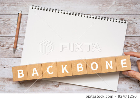 Blocks, notebooks, pens, hands labeled "BACK BONE" 92471256