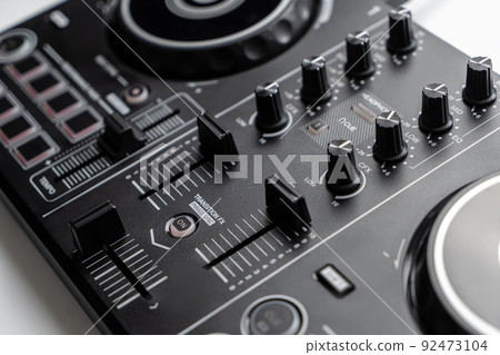 DJ mixing deck Controller connecting to Laptop and tablet using USB cable. 92473104