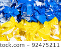 Rolled yellow and blue paper, Ukrainian flag 92475211