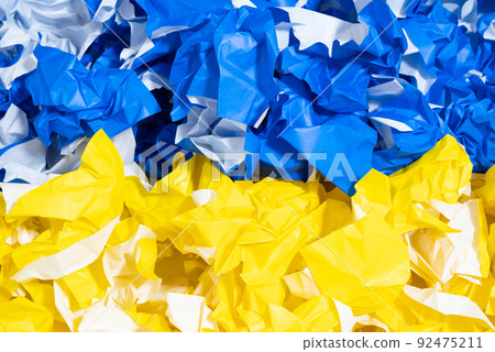 Rolled yellow and blue paper, Ukrainian flag 92475211