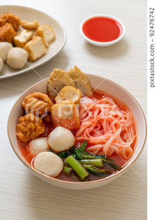 small flat rice noodles with fish balls and shrimp balls in pink soup, Yen Ta Four or Yen Ta Fo small flat rice noodles with fish balls and shrimp balls in pink soup, Yen Ta Four or Yen Ta Fo 92476742