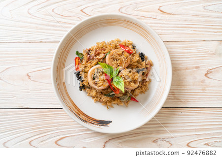 Basil and Spicy Herb Fried Rice with Squid or Octopus 92476882