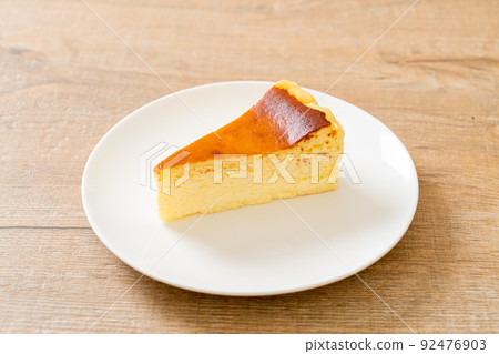 burn cheesecake on white plate burn cheesecake on white plate 92476903