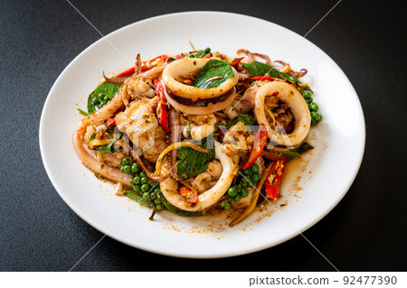 stir fried holy basil with octopus or squid and herb 92477390