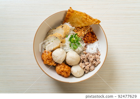 spicy small flat rice noodles with fish balls and shrimp balls without soup spicy small flat rice noodles with fish balls and shrimp balls without soup 92477629