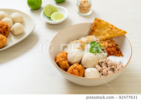 spicy small flat rice noodles with fish balls and shrimp balls without soup spicy small flat rice noodles with fish balls and shrimp balls without soup 92477631