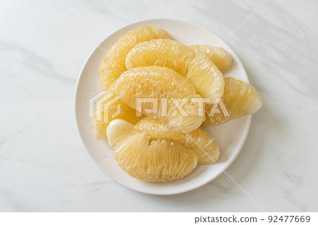 Fresh peeled pomelo, grapefruit or shaddock 92477669
