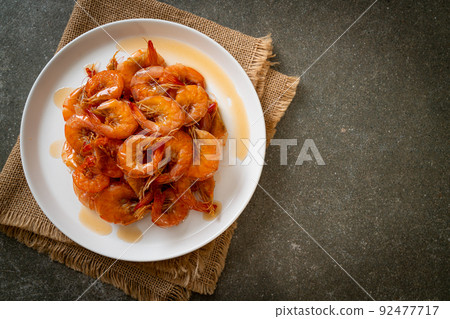 Sweet shrimps is Thai dish which cooks with fish sauce and sugar Sweet shrimps is Thai dish which cooks with fish sauce and sugar 92477717