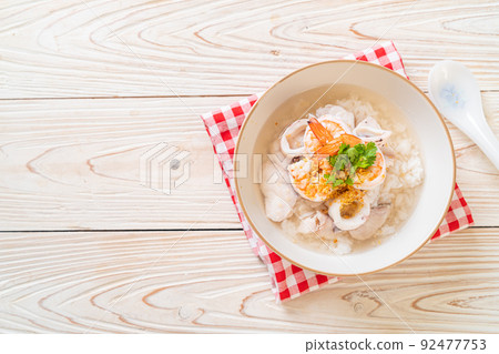 boiled rice soup with seafood 92477753