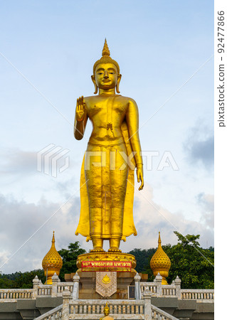 A golden buddha statue on the mountain top at Hat Yai municipality public park, Songkhla Province, Thailand A golden buddha statue on the mountain top at Hat Yai municipality public park, Songkhla Province, Thailand 92477866