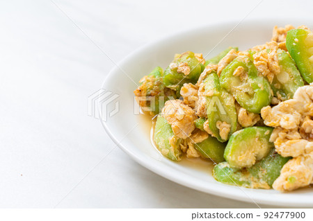 Stir Fried Angled Gourd with Egg Stir Fried Angled Gourd with Egg 92477900