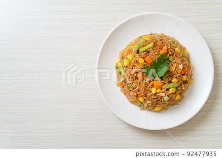 fried rice with green peas, carrot and corn fried rice with green peas, carrot and corn 92477935