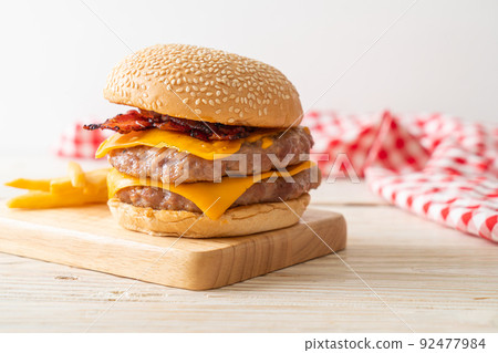 pork burger with cheese, bacon and french fries 92477984