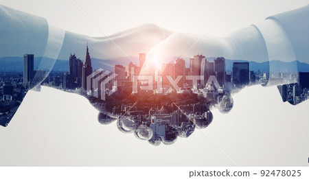 Handshake businessmen and cities Horizontal visuals for banners and advertisements 92478025