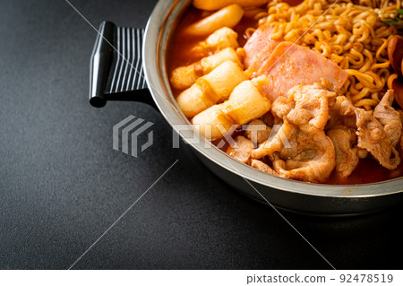 Budae Jjigae or Budaejjigae (Army stew or Army base stew). It is loaded with Kimchi, spam, sausages, ramen noodles and much more 92478519