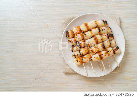 grilled tube shaped fish paste cake skewe or tube squid skewer 92478580